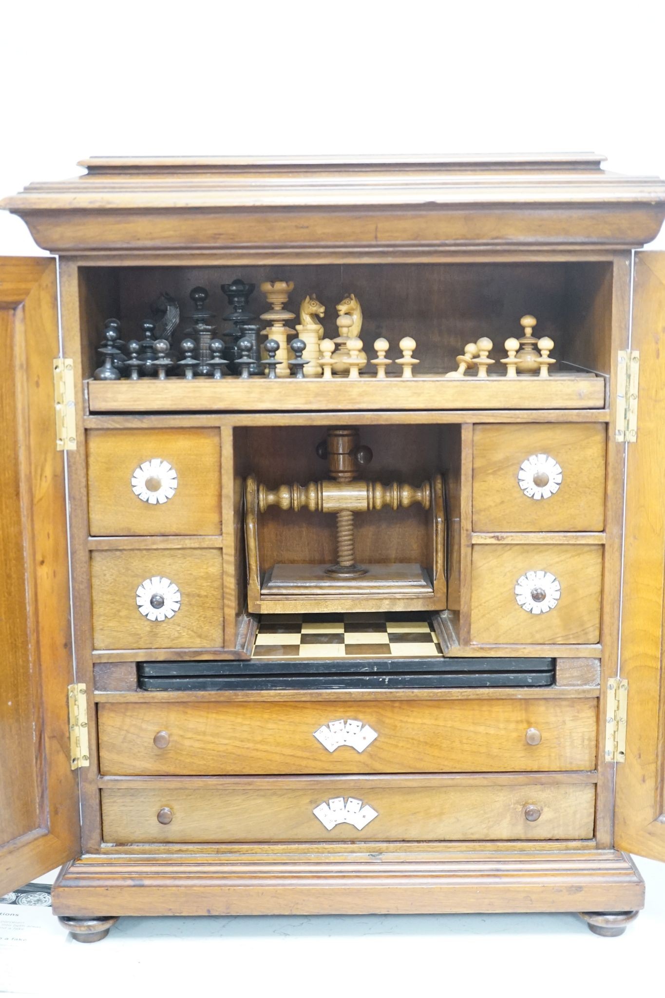 A late 19th century gilt metal mounted walnut games cabinet, W.40cm D.19cm H.49cm